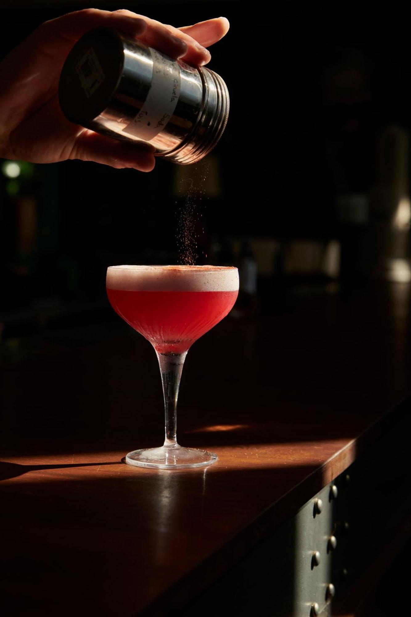 The Click Clack Hotel Medellín Exteriör bild A Clover Club cocktail being garnished with ground nutmeg